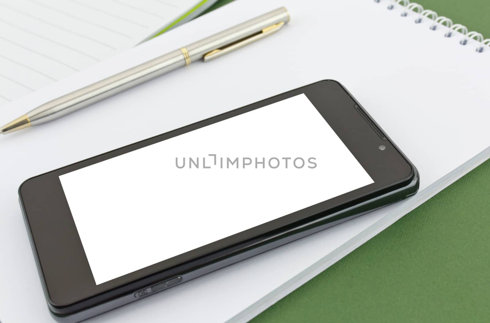 new mobile phone isolated on white notebook
