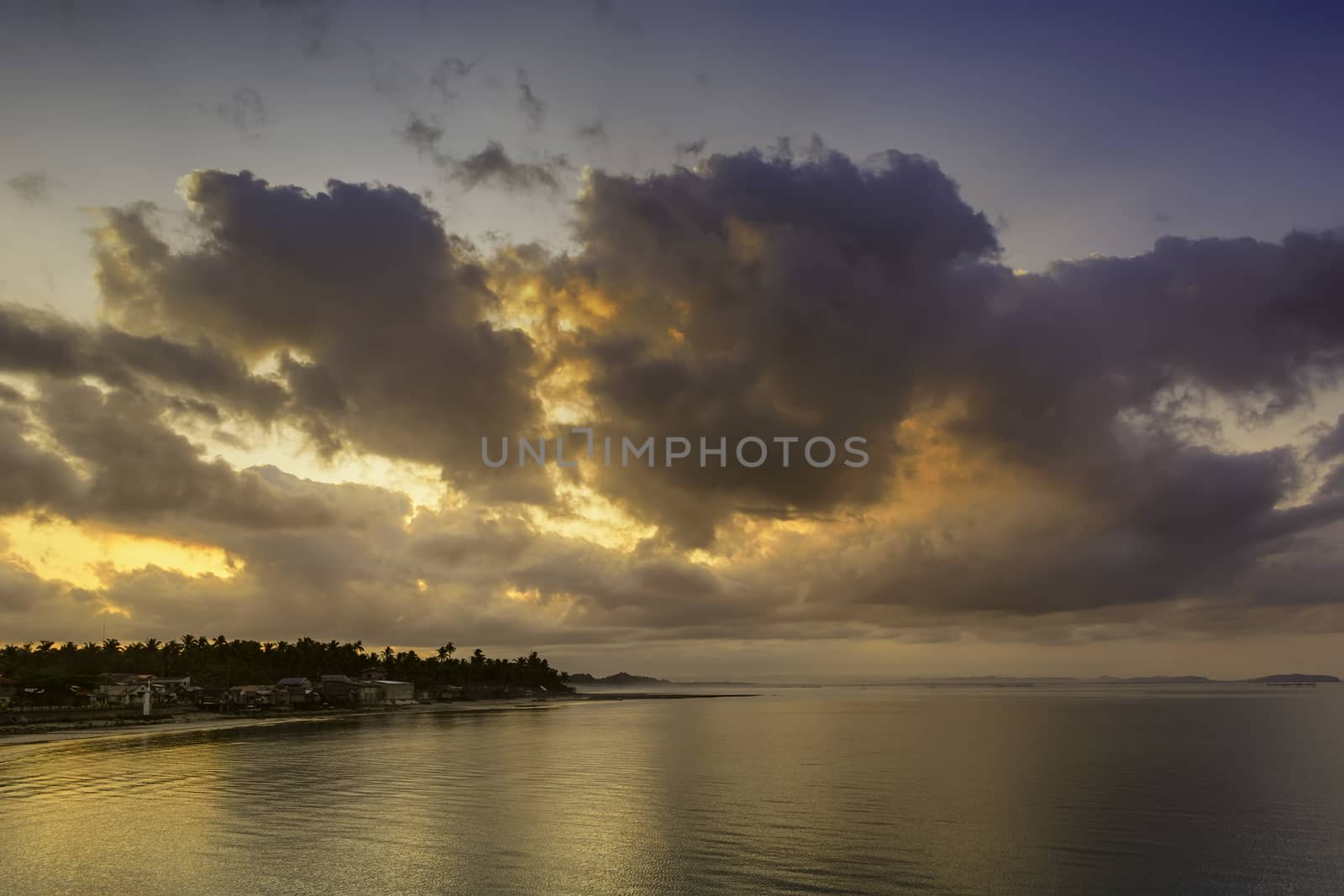 Early morning sun over a fishing village in the Philippines.