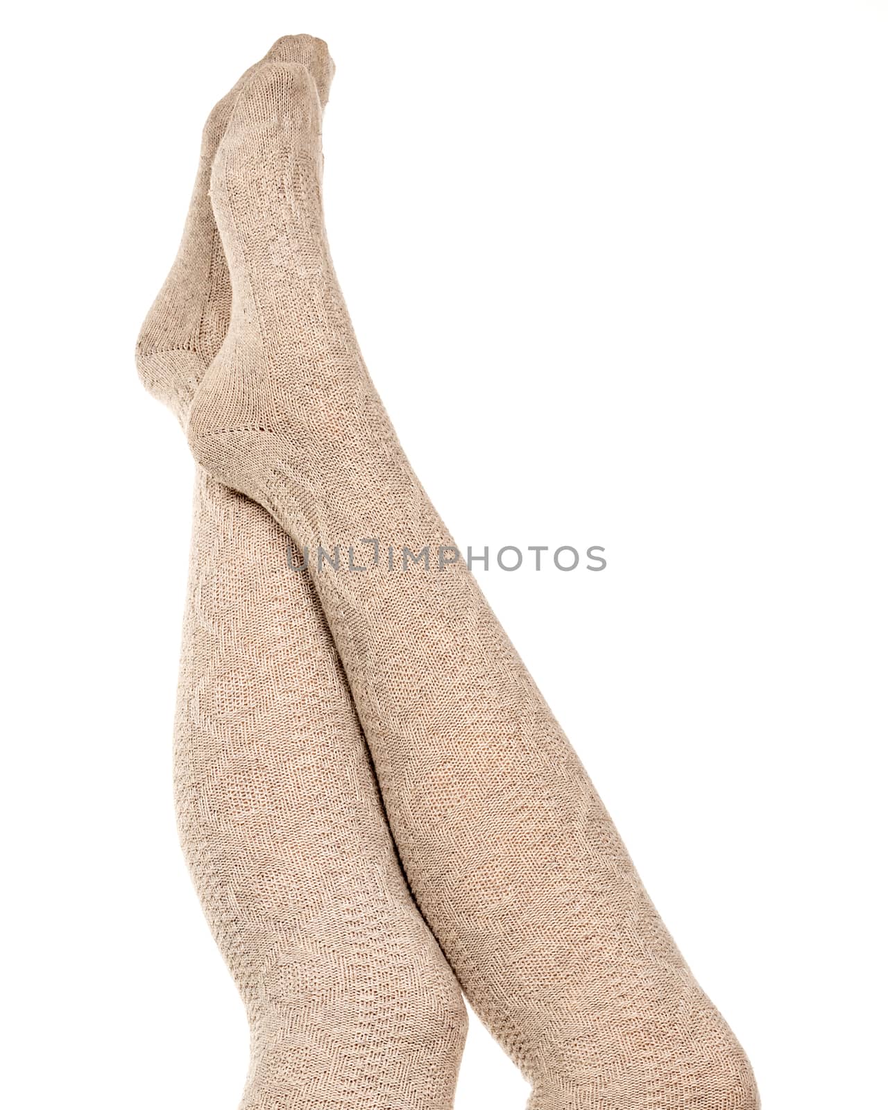 Female legs in knitted socks, white background, isolated