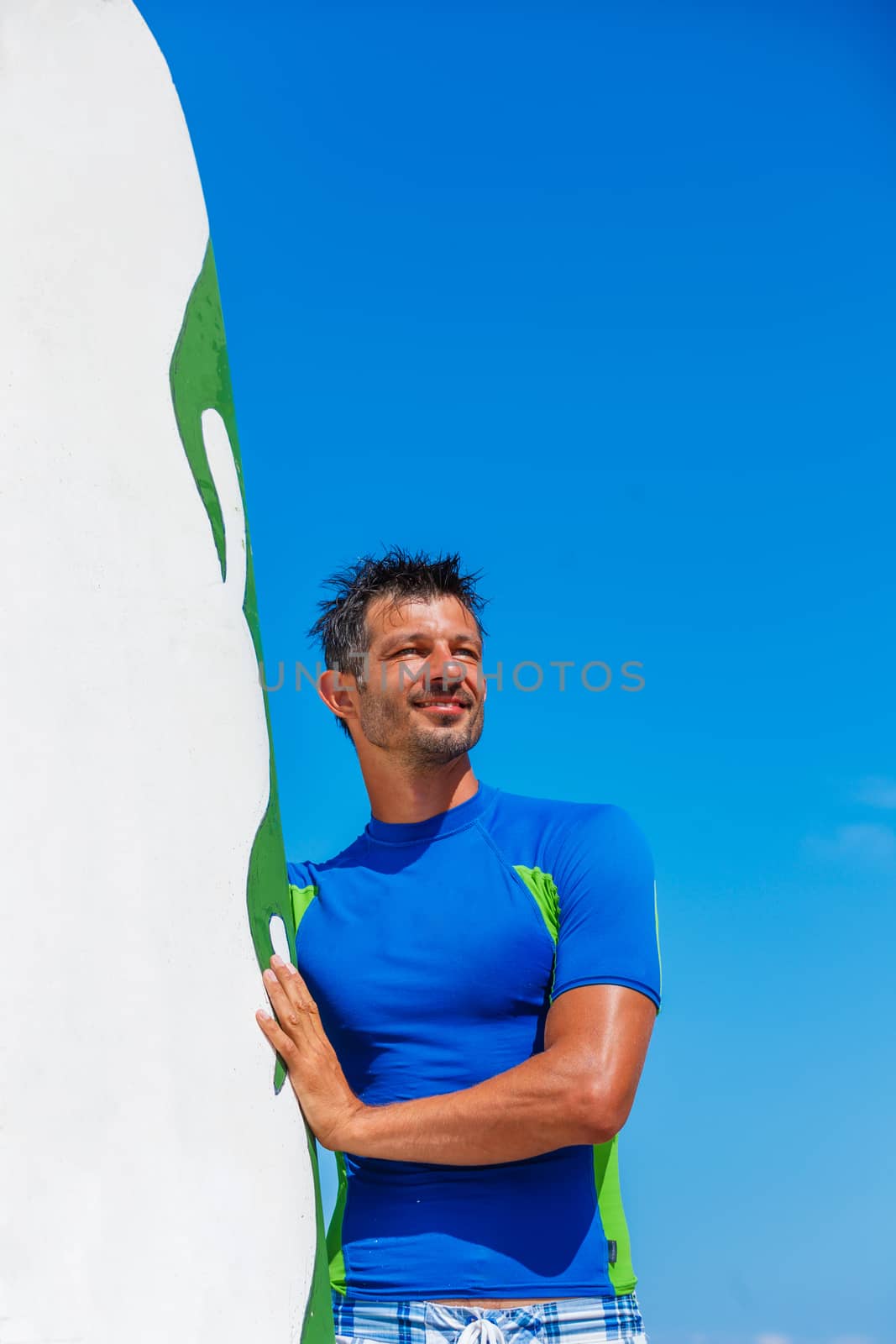 Father holding son on his shoulders at the beach