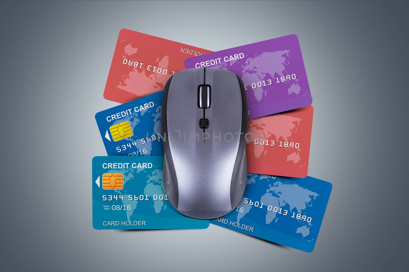 Finance concept, colorful credit cards under computer mouse over dark background.