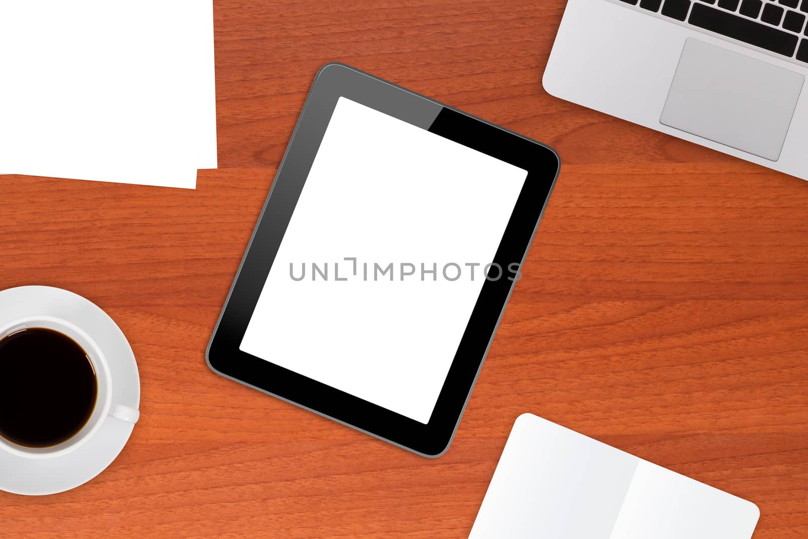 Tablet mock up with blank, white screen, laptop, coffee and note book on modern office table.