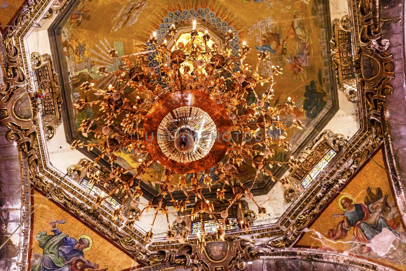 Dome Chandelier Mosaics Old Basilica Guadalupe Mexico City Mexico. Also known as Templo Expiatorio a Cristo Rey.  Basilica construction was started in 1531, finished in 1709.  This is the basilica is the location where the Virgin Mary appeared to the Meixcan peasant Juan Diego.  The old Basilica is where Juan Diego's original cloak with the picture of the Virgin Mary first appeared. 