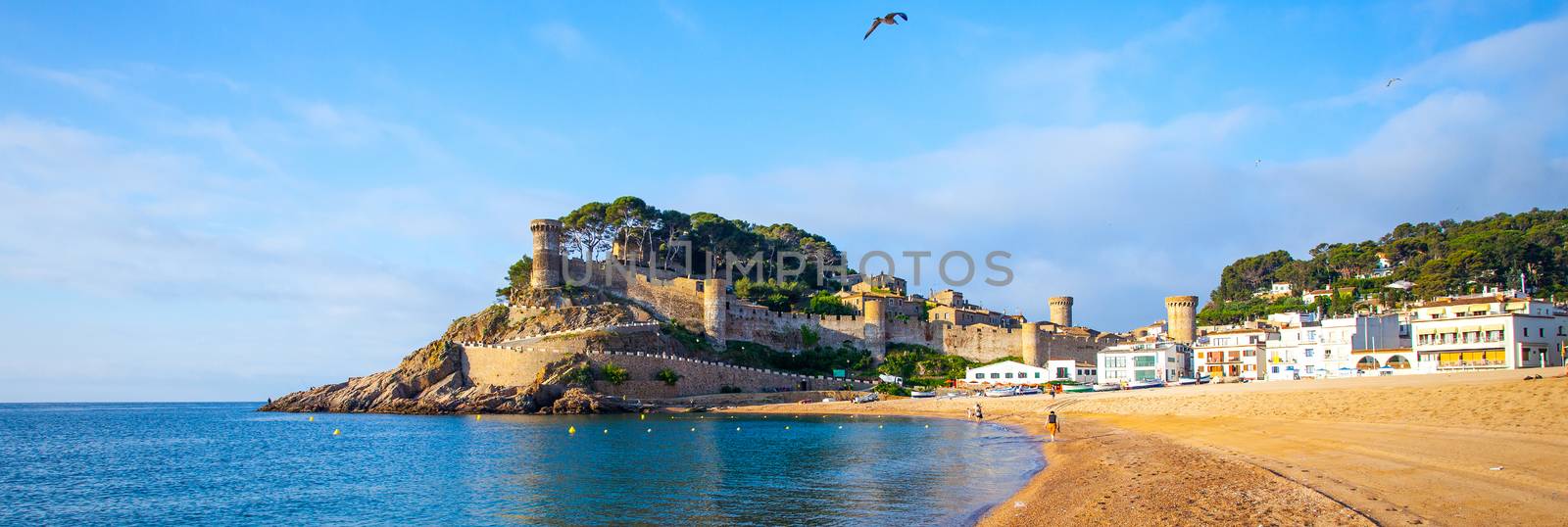 Tossa de Mar, Catalonia, Spain, JUNY 13, 2013, the panorama overlooking the bay Badia de Tossa and medieval fortress Vila Vella on a rock. Editorial use only