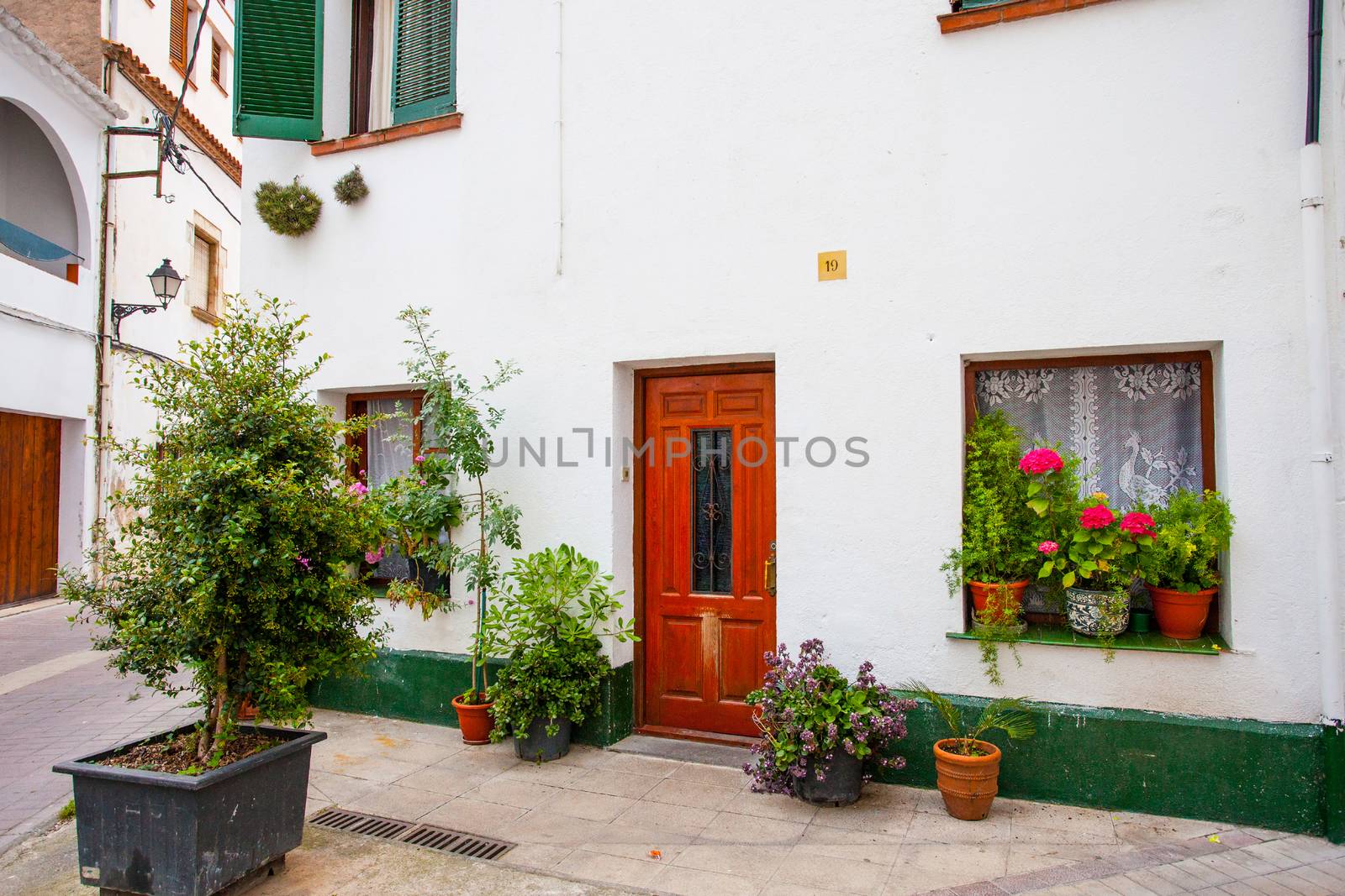 Tossa de Mar, Catalonia, Spain, 2013.06.23, An outside pots filled with vibrant multicolored flowers, editorial use only