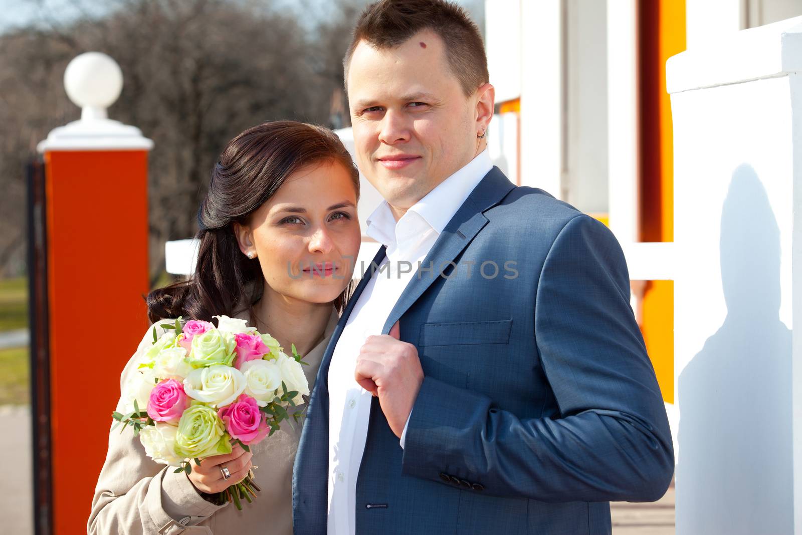 bride with bouquet and groom