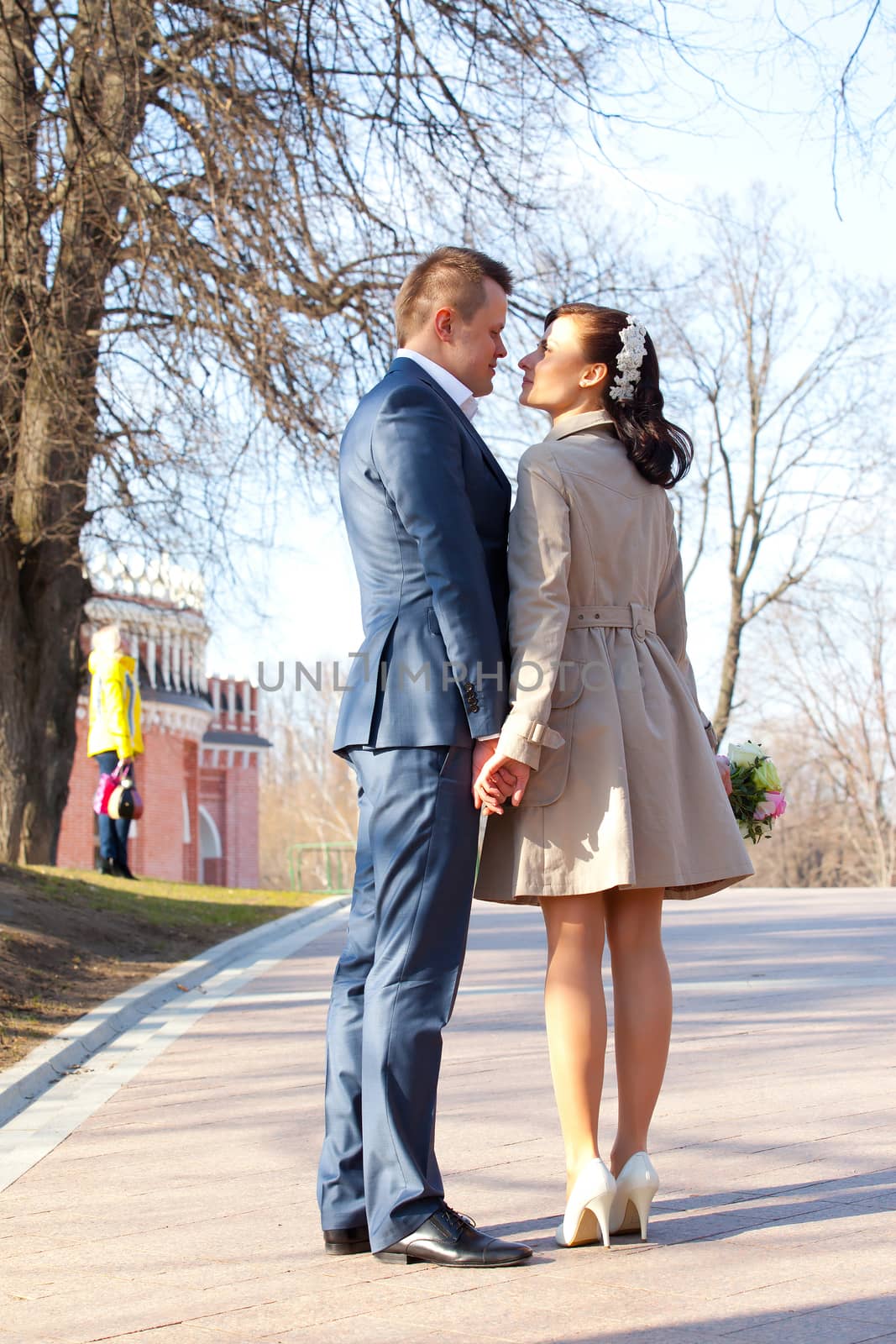 bride and groom on a park background