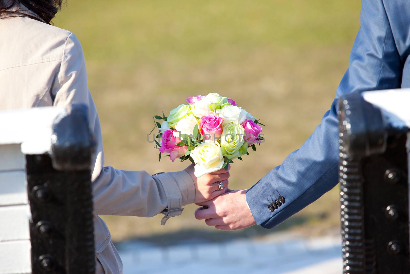 Wedding couple holding a bouquet