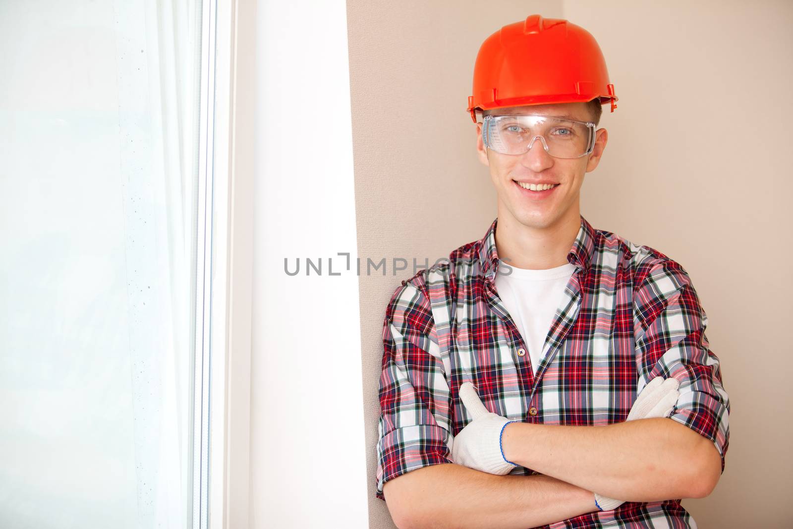 Portrait of happy young male construction worker