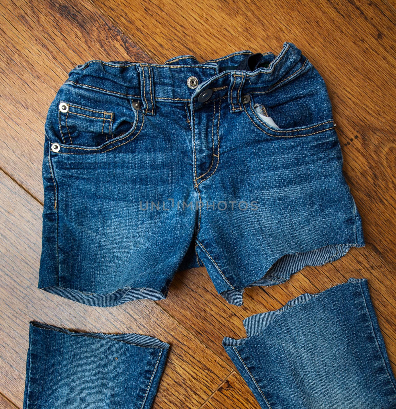 cut old jeans on wooden boards