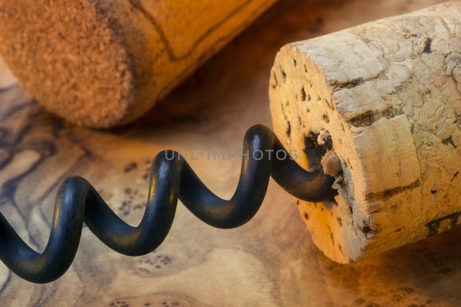 Pulling cork from a wine bottle using a corkscrew