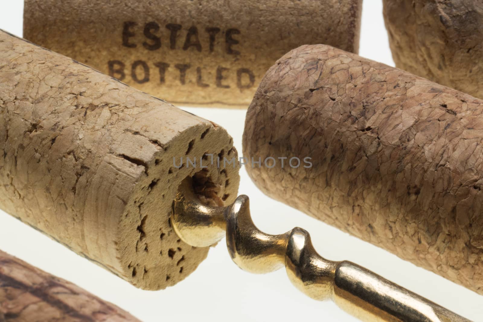 Pulling cork from a wine bottle using a corkscrew