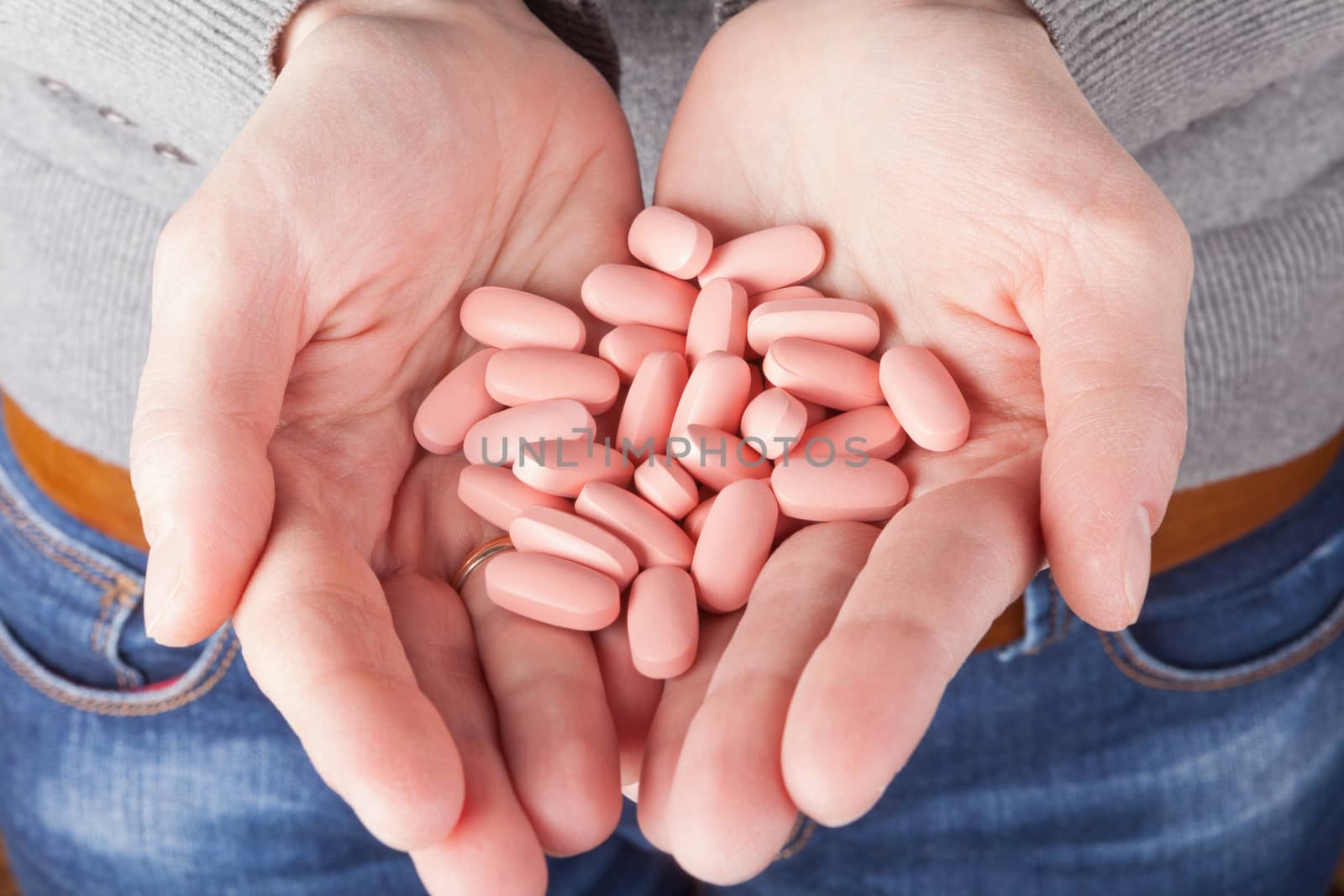many pills in the hands. medicine concept
