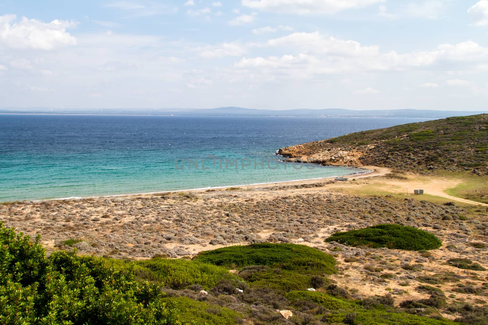 View of sea coast and cloudy sky.