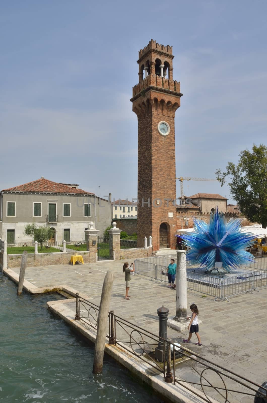 Clock tower and a blue murano glass sculpture by monysasi