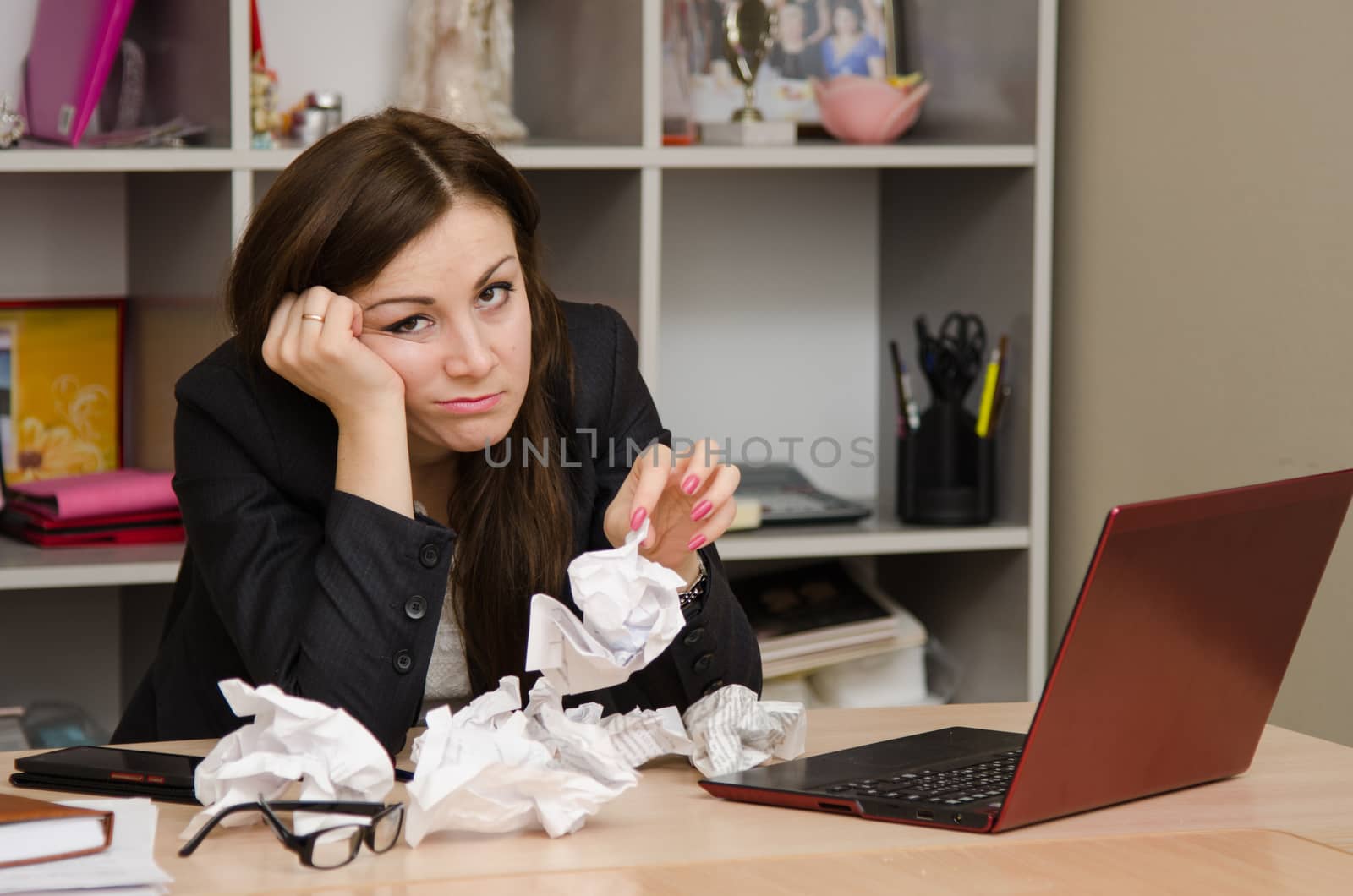 Cute business woman in the office at the computer