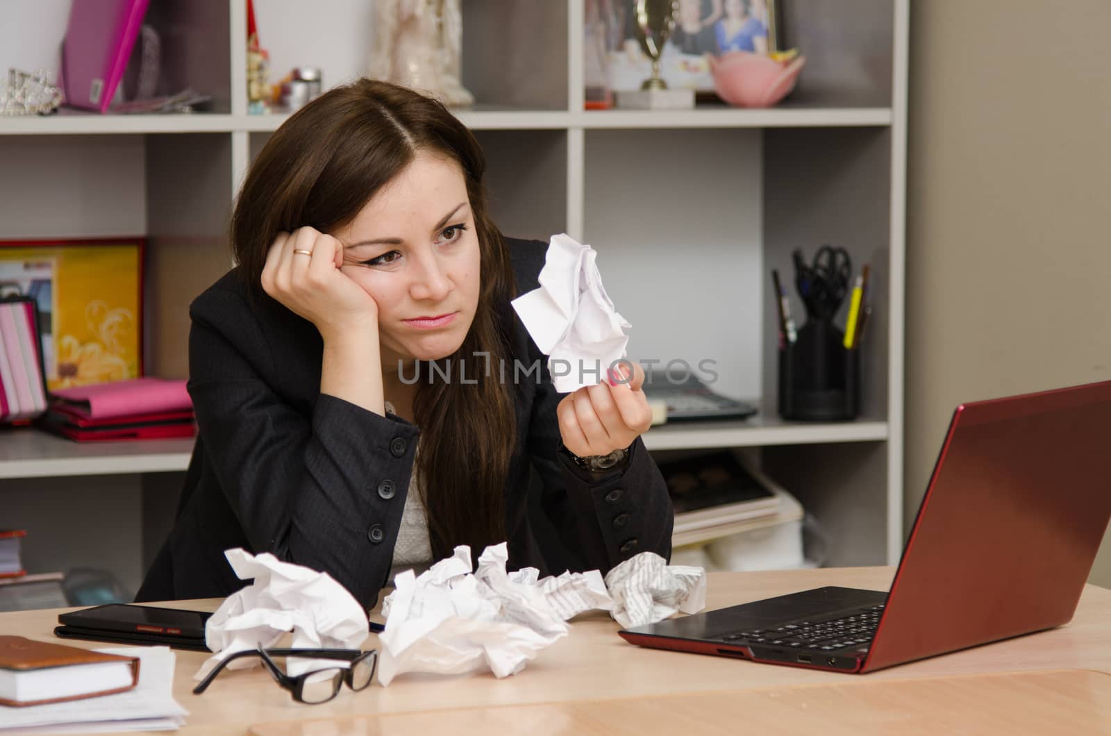 Cute business woman in the office at the computer