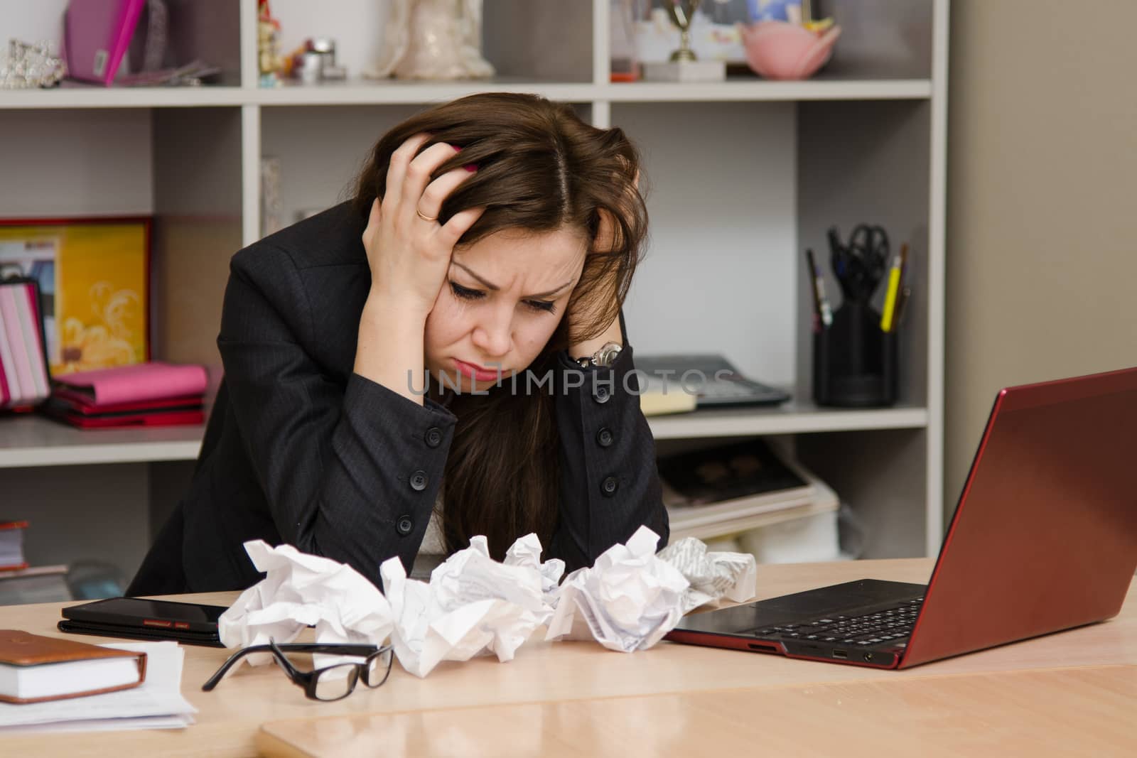 Cute business woman in the office at the computer