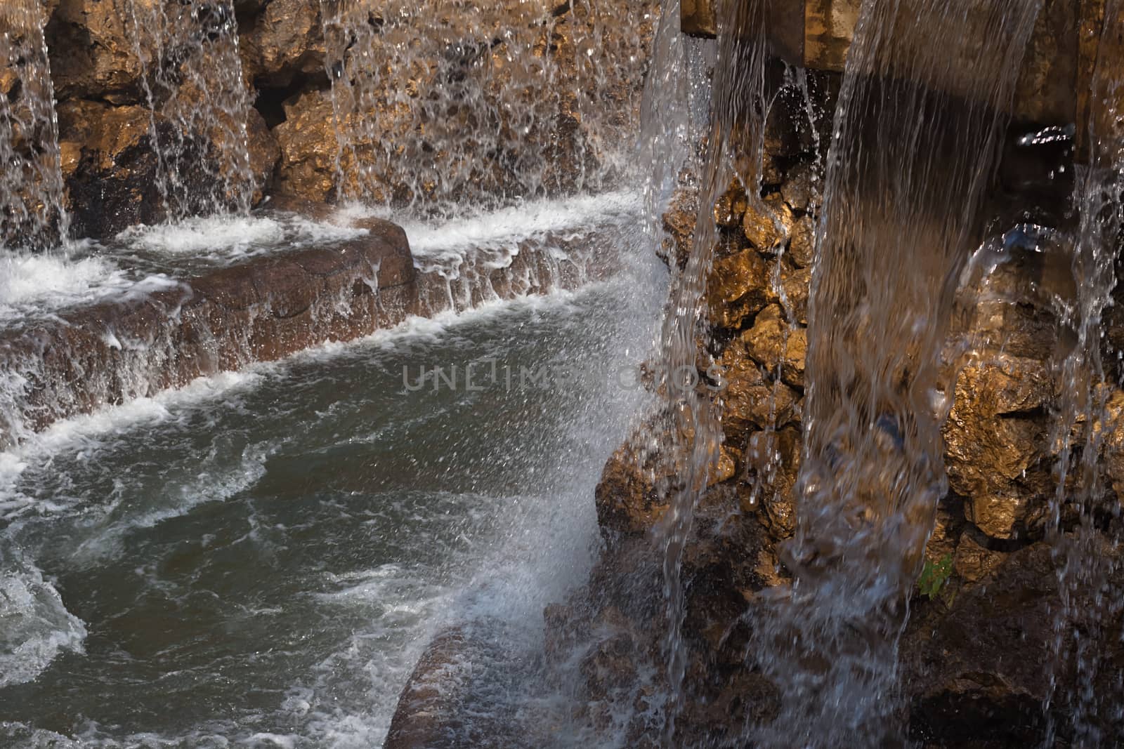  The water falling from above on stones on a decline of day