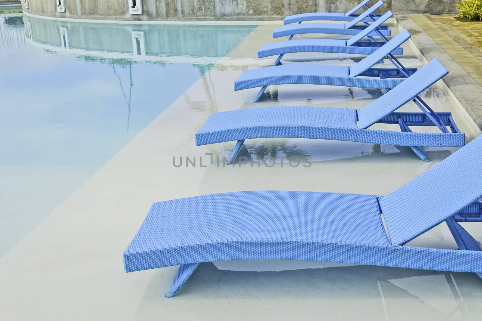 Turquoise pool benches in Philippine hotel