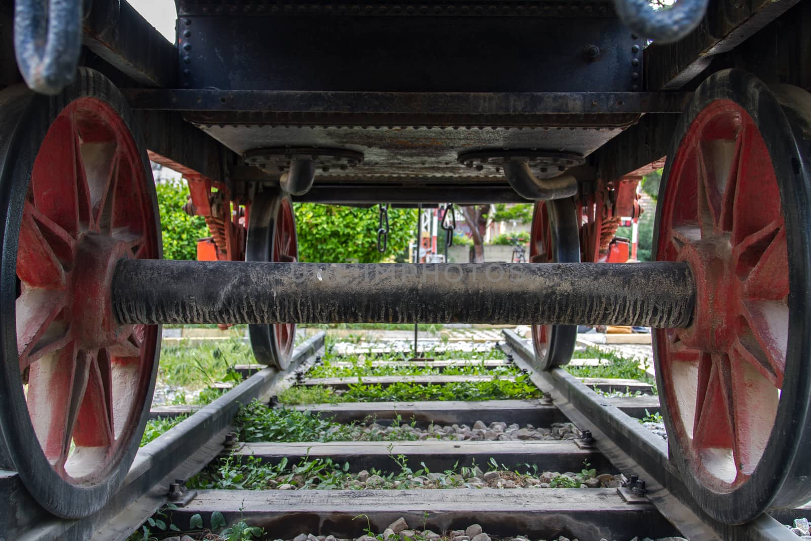 Back and bottom view of train on railway in museum.