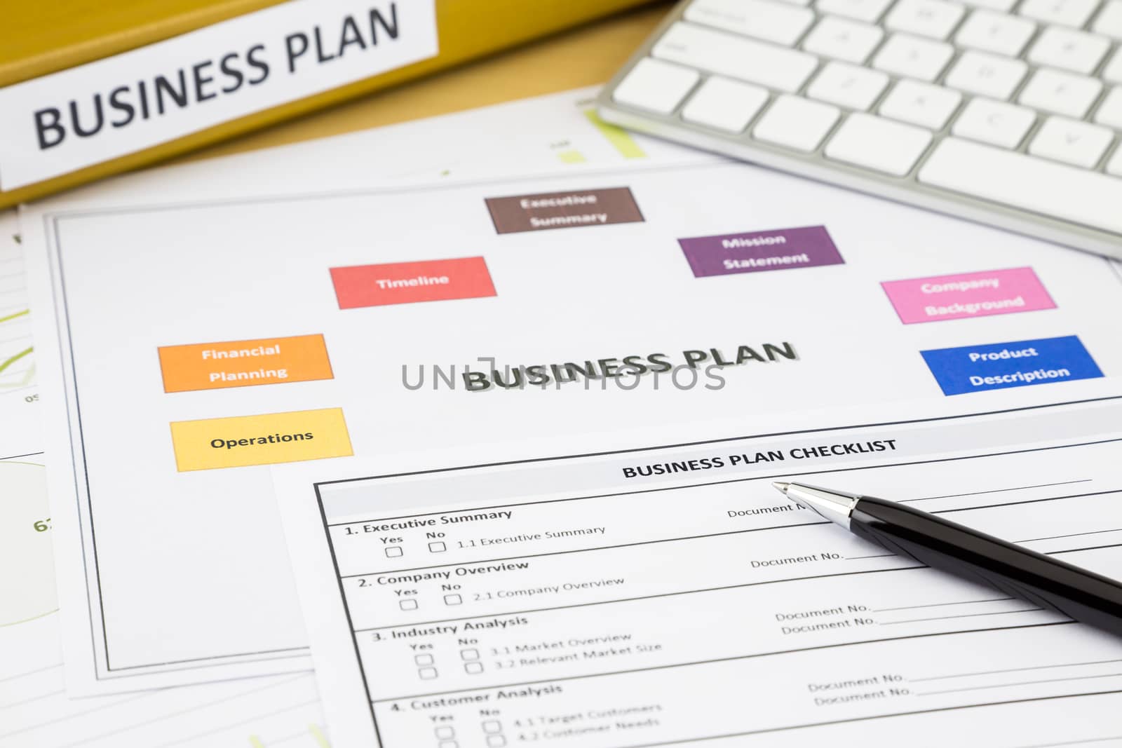 Business plan checklist and paperwork place on office table