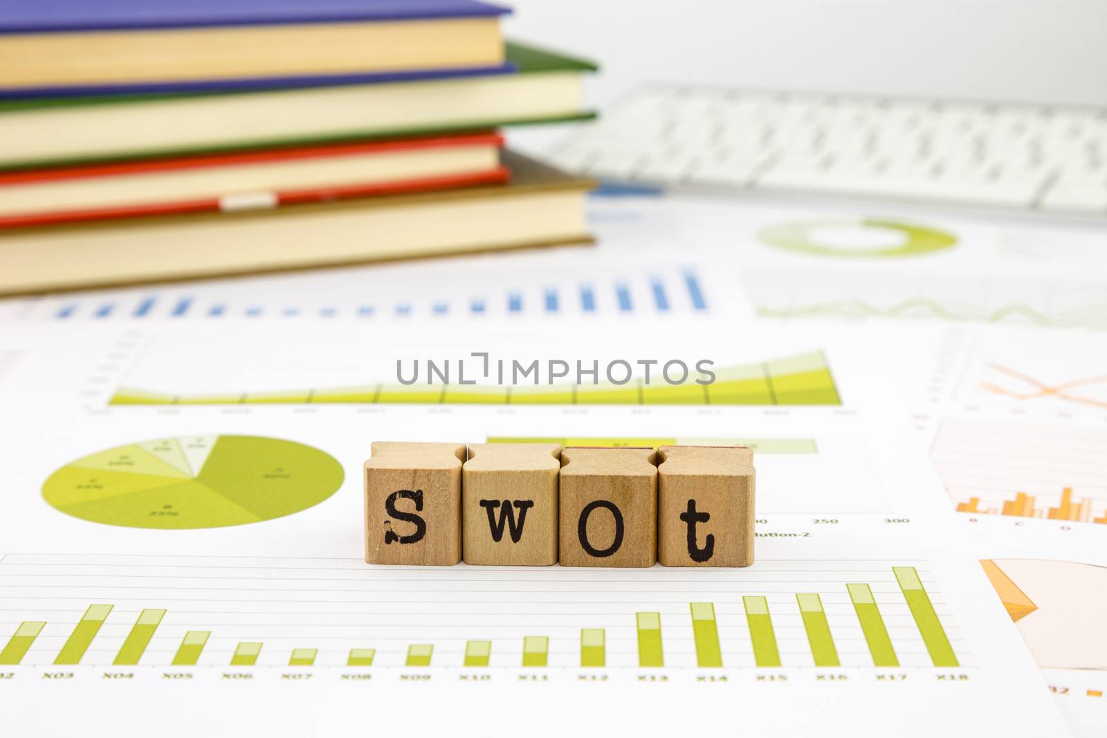 SWOT word on rubber stamps place on graph analysis of business reports concept to evaluate and planning projects
