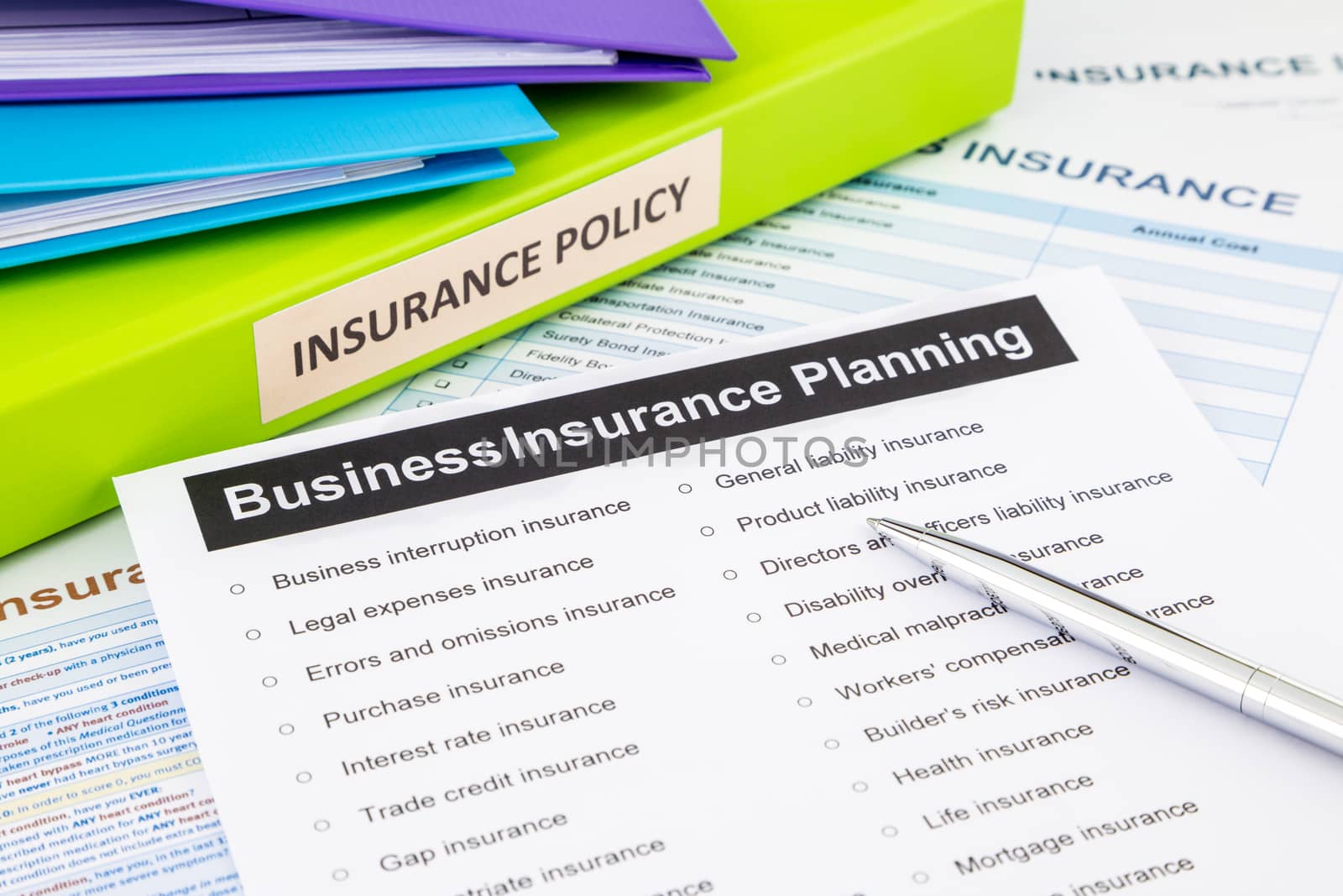 Business insurance planning checklist with documents and binders, concept for risk management