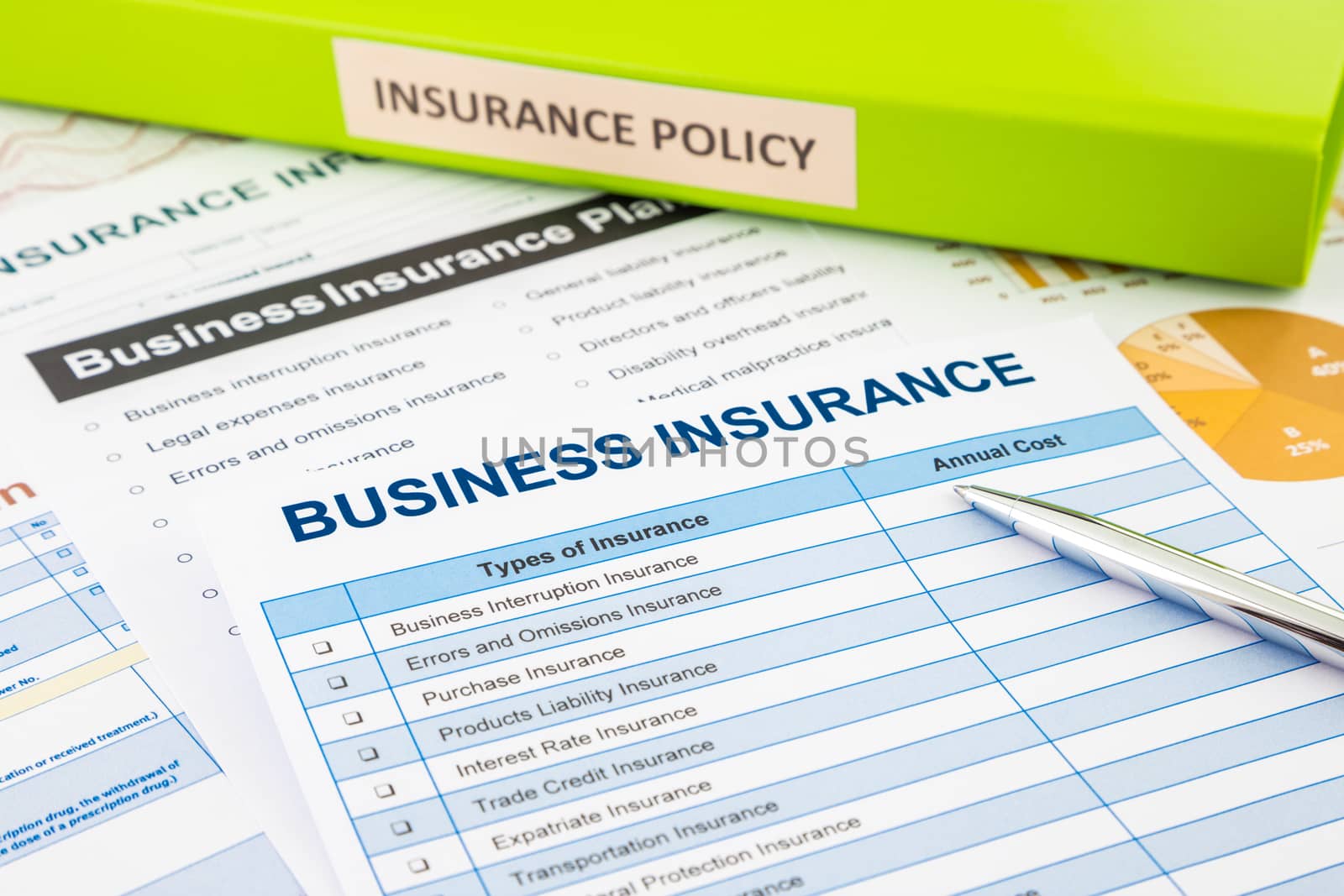 Business insurance planning with checklist forms and document binder, concept for risk management