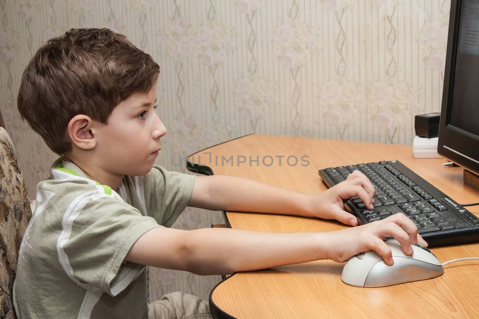 little boy running on the computer