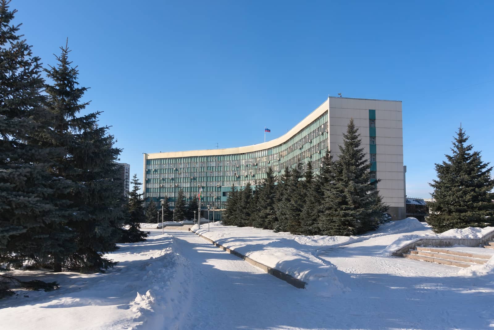 a large office building with spruce winter