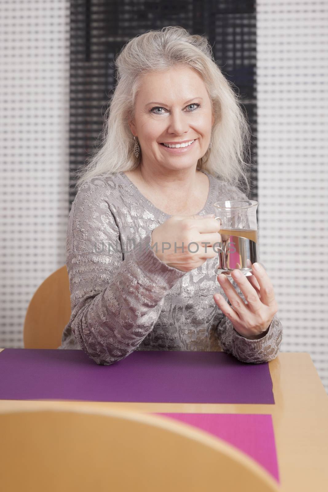 An image of a best age woman with a cup of tea