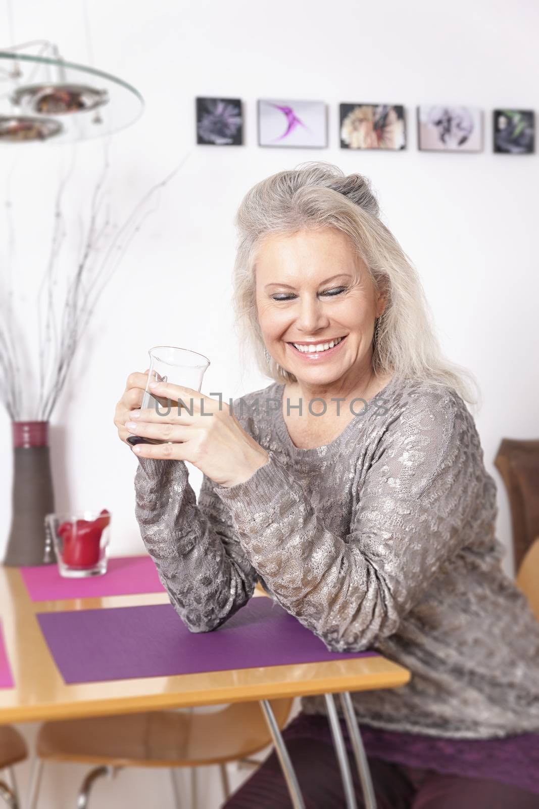 An image of a best age woman with a cup of tea