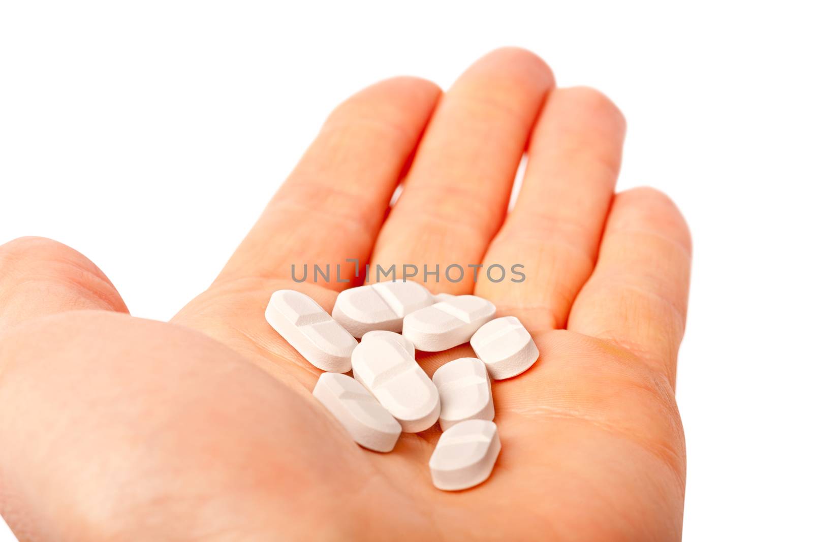 pills in the hands isolated on white medicine concept