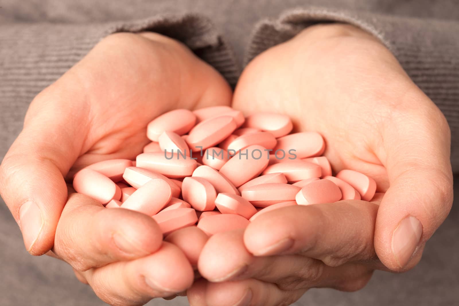 many pills in the hands. medicine concept
