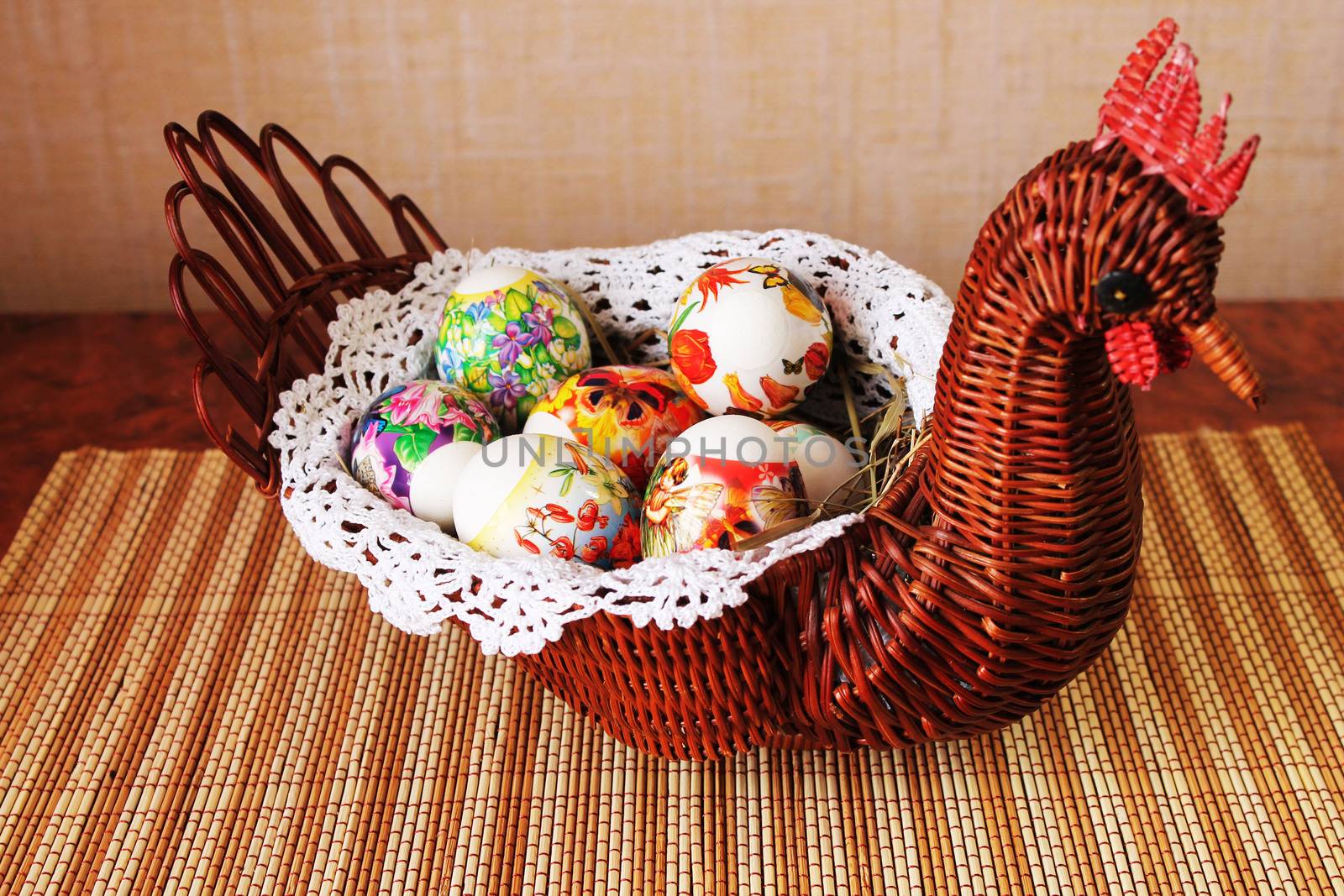 Decorative wicker vase in the form of chicken with Easter eggs inside