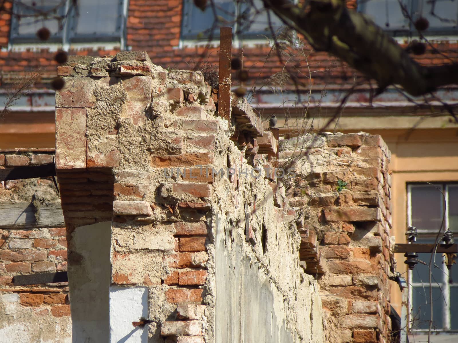 ruined house without a roof and walls serverely damaged