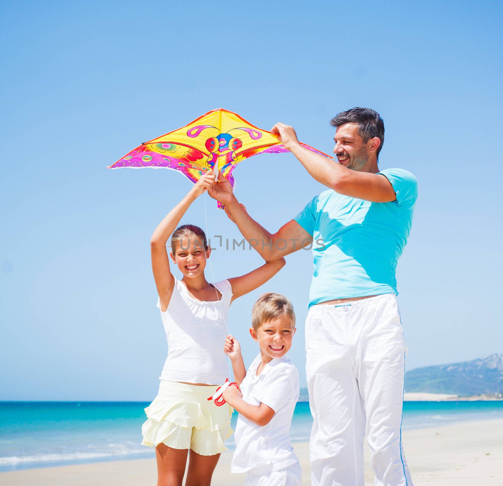 Boy and his father with kite. by maxoliki