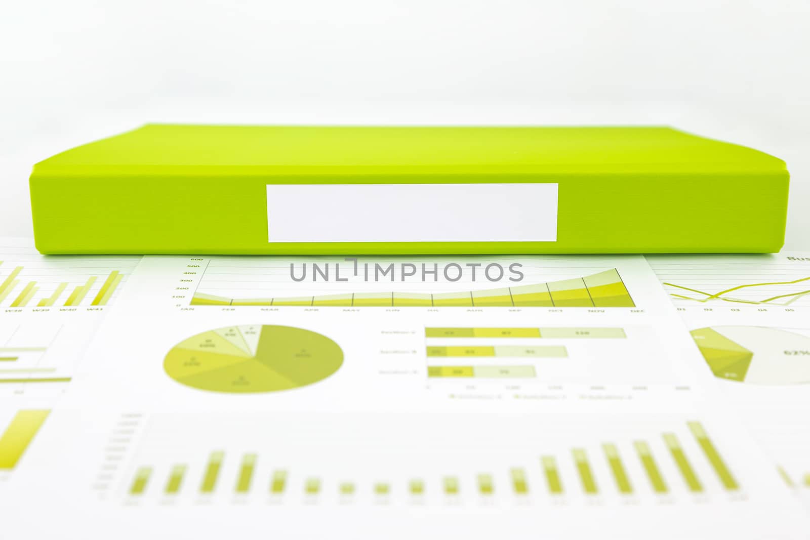 Blank green folder with analytic graph and educational reports by vinnstock