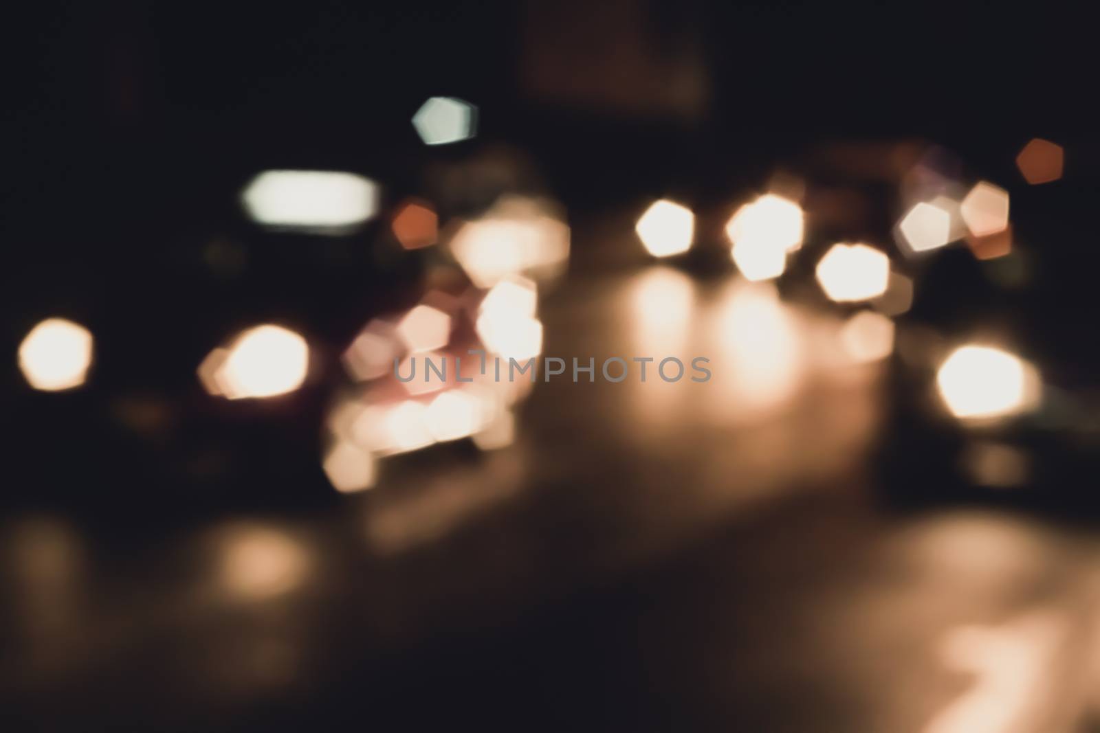 abstact blur bokeh road in city by kaisorn