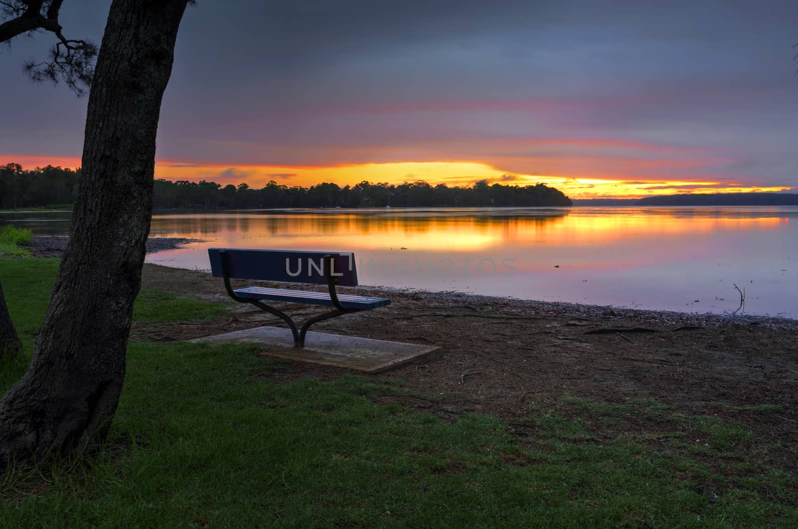 Even rainy days can be beautiful at Paradise Beach Reserve on foreshores of St Georges Basin as the sun goes down behind the clouds..  Basin walk will take you along much of its winding foreshore.