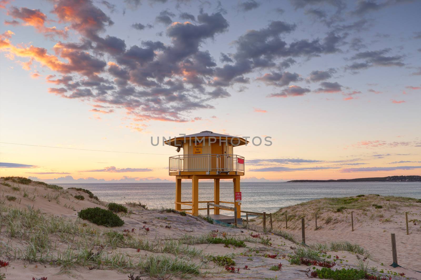 Wanda Beach Lifeguard lookout tower with sunrise skies