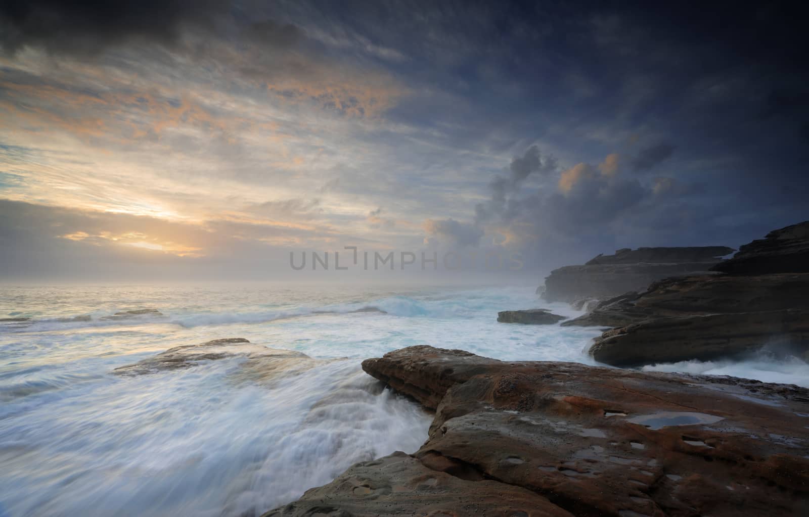 Turbulent ocean currents build unabated like unbridled passions washing over steadfast rocks that do not surrender  but stands firm.   Little Bay, NSW Australia