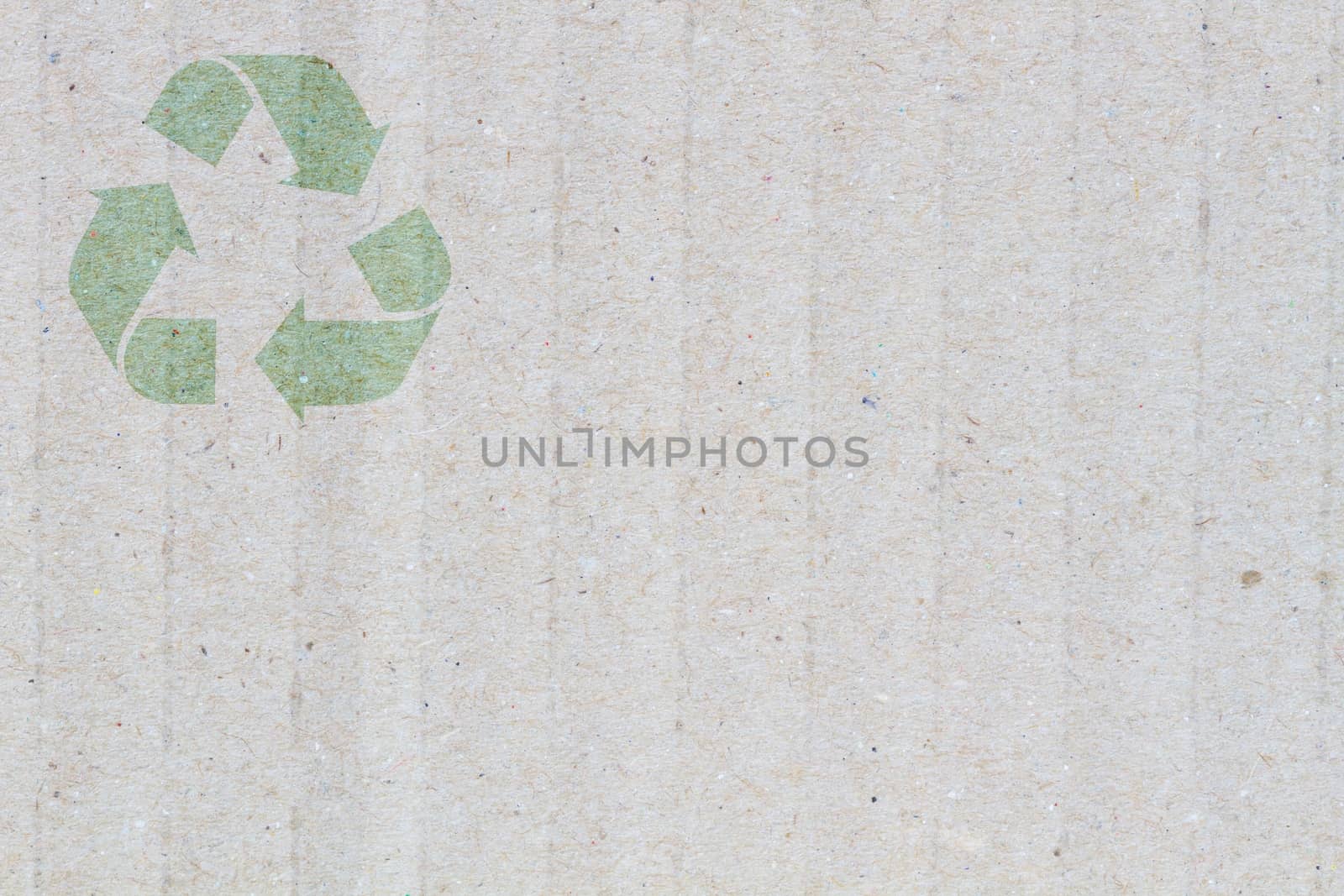 close-up Grey cardboard Paper Background with detail texture, macro, with symbol of recycle on the upper corner