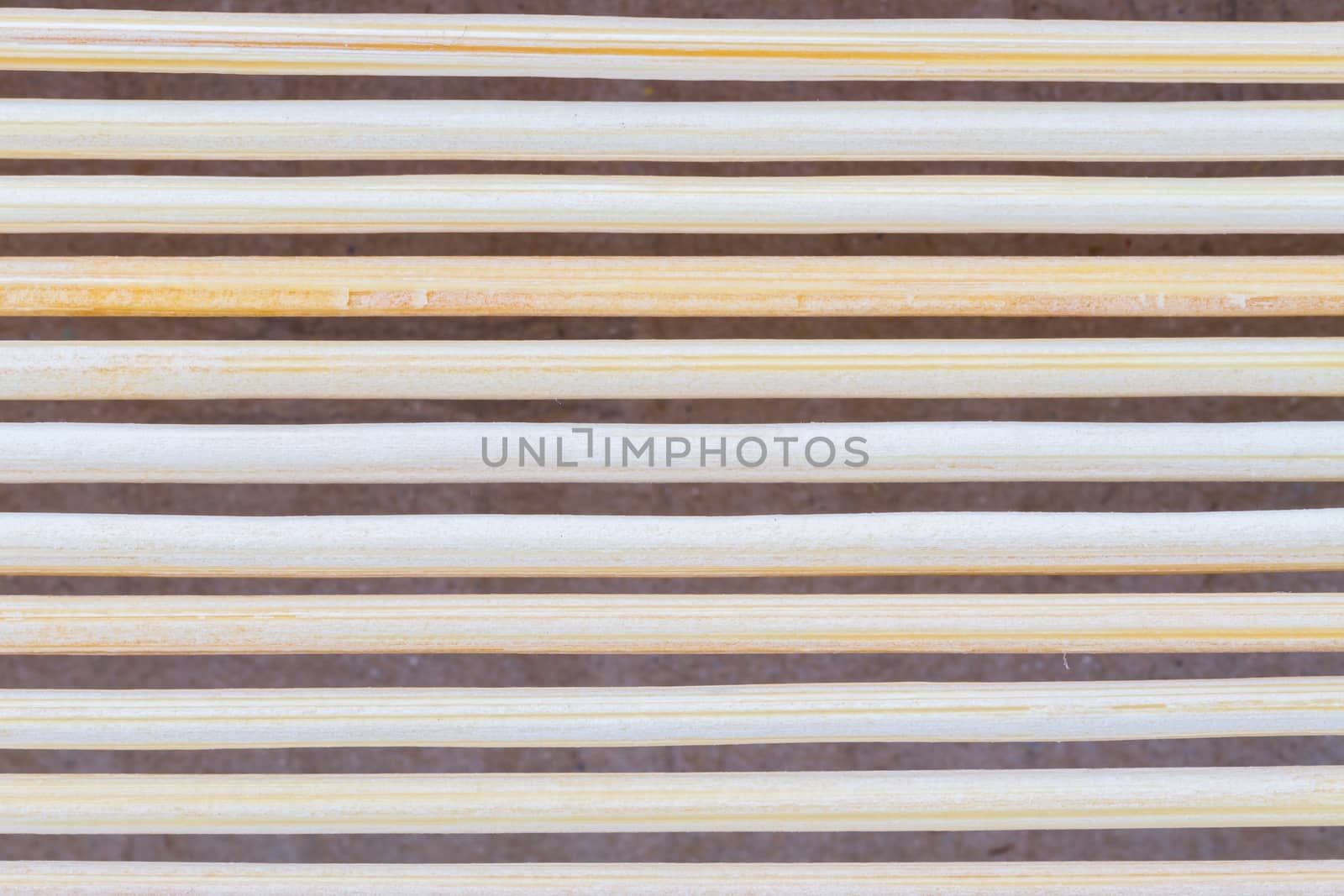 Close up macro of beige brown bamboo mat as striped background t by a3701027