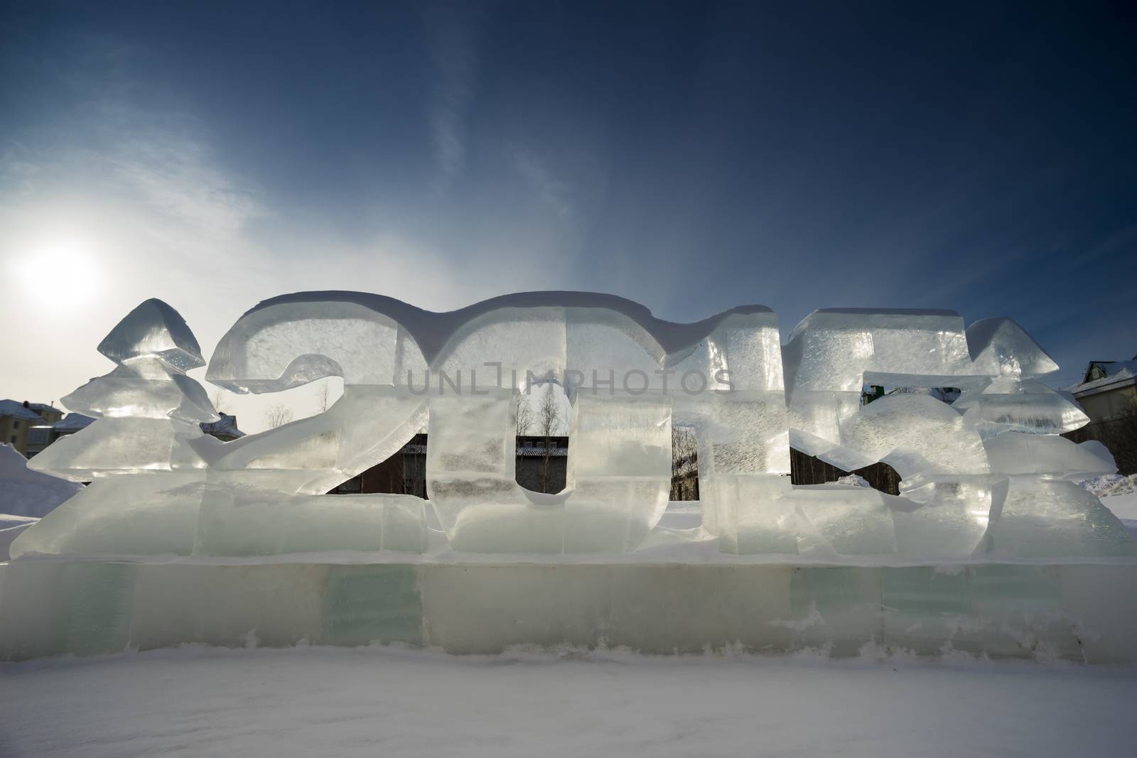 Two Christmas trees and figures of the New 2015 made of ice.