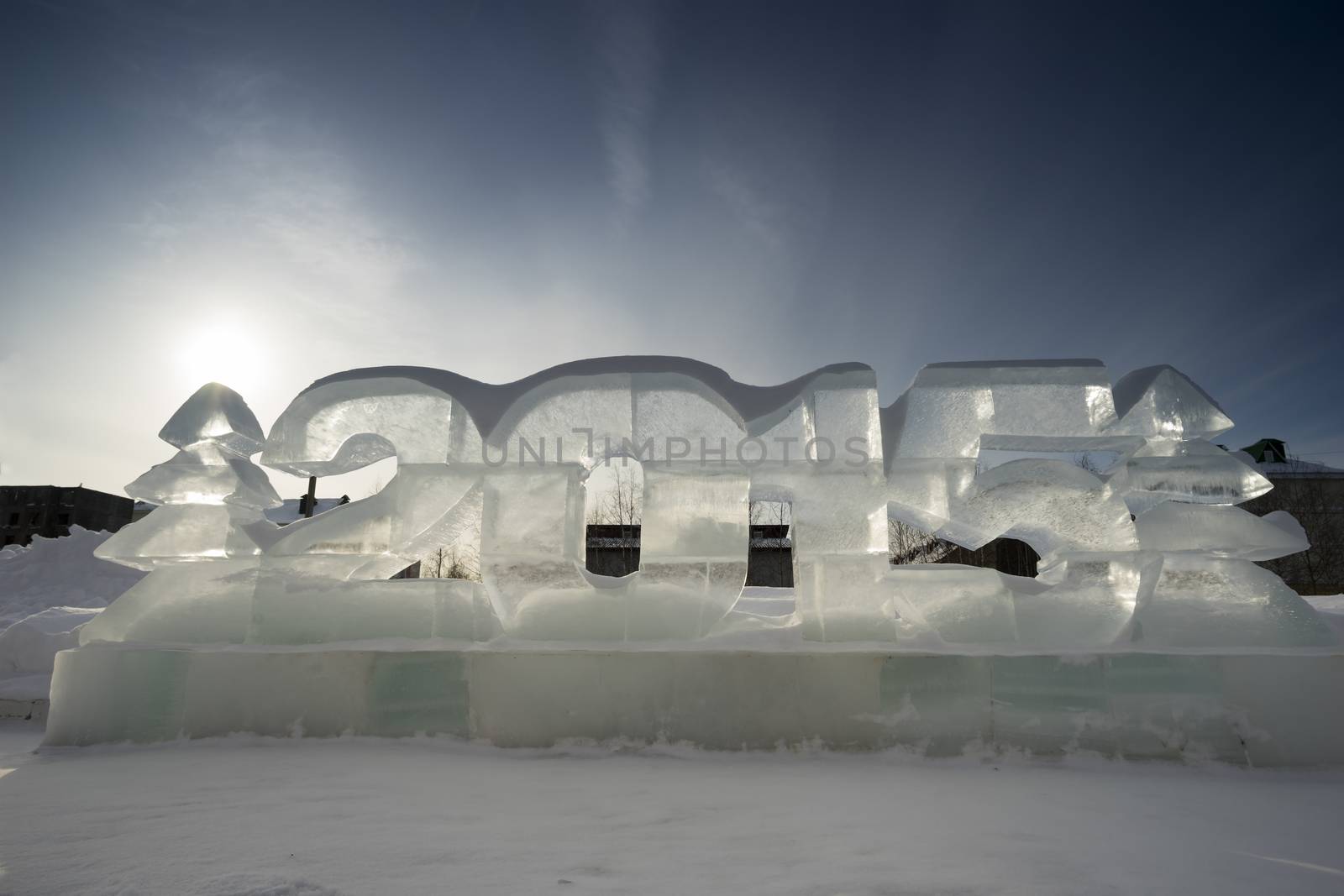 Two Christmas trees and figures of the New 2015 made of ice.