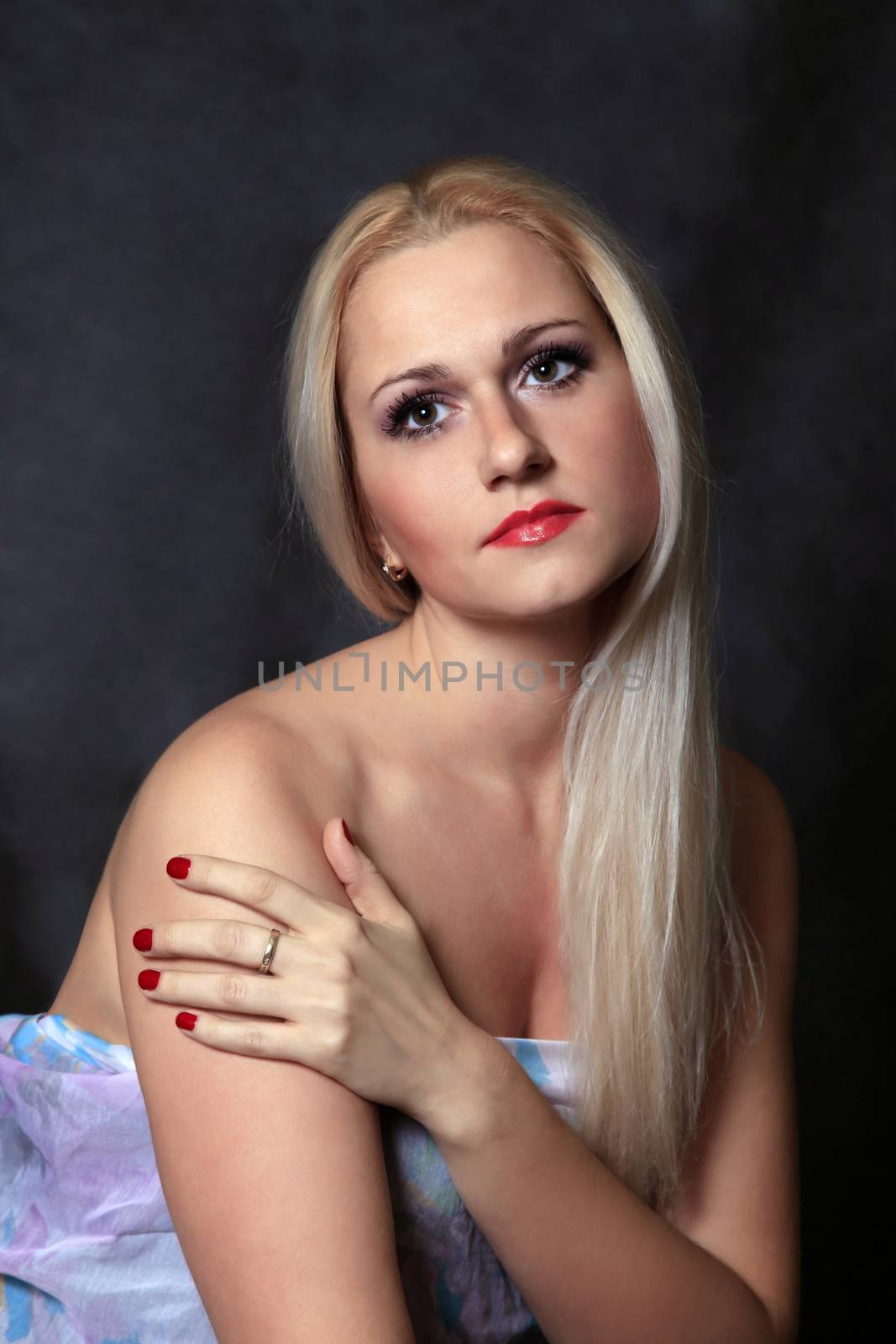 Beautiful young blond woman portrait in studio