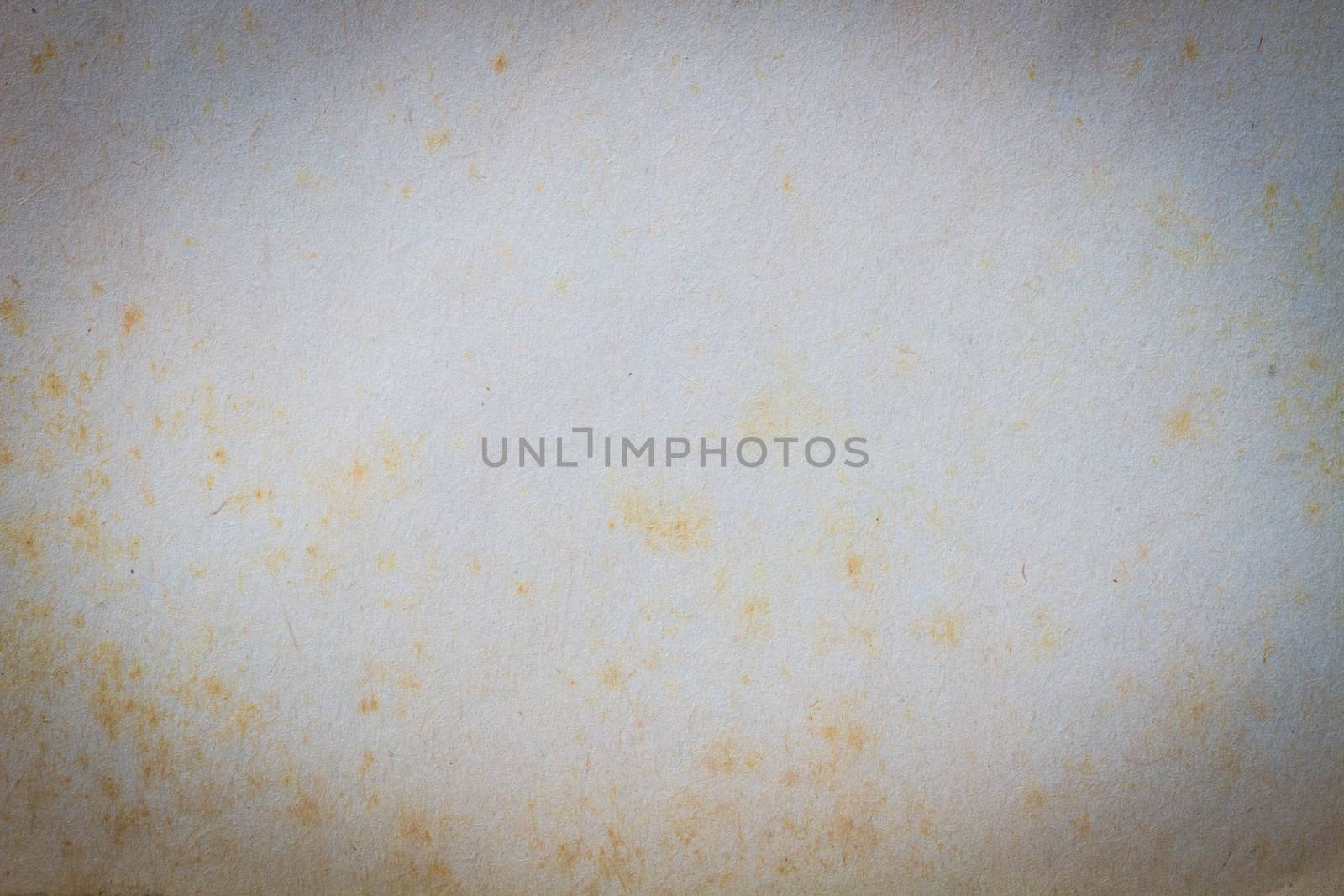 texture of old paper with yellow stain, background, copyspace and vignette