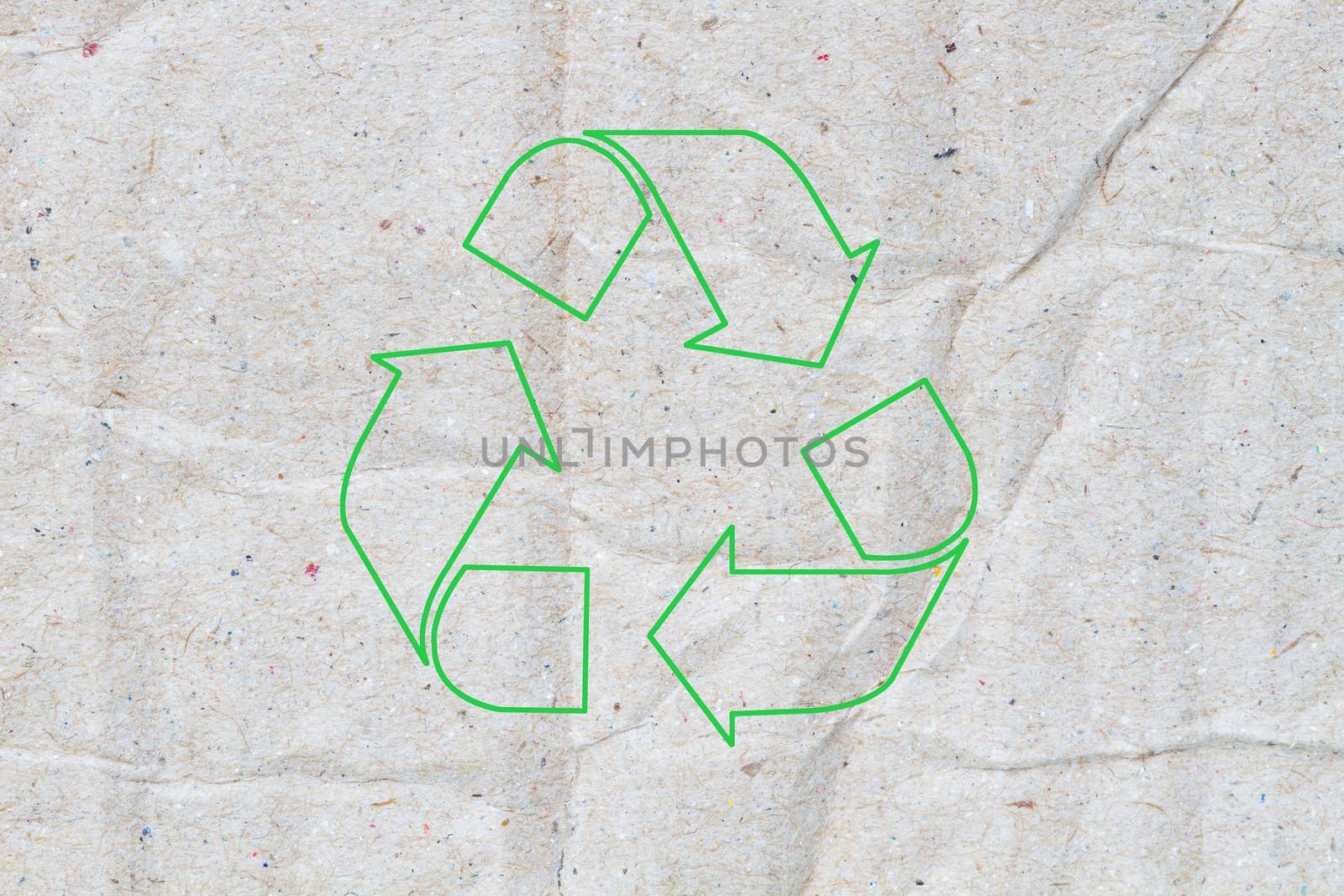 Old vintage cardboard paper texture or background, with green sign of recycle